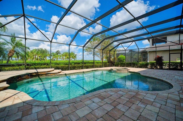 view of pool featuring an in ground hot tub, a lanai, and a patio area