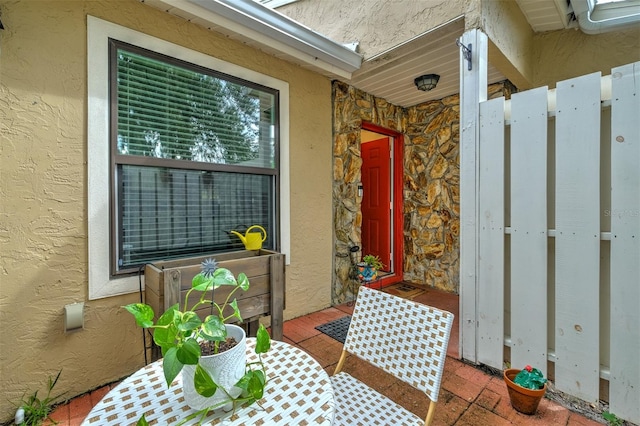 view of exterior entry featuring stucco siding