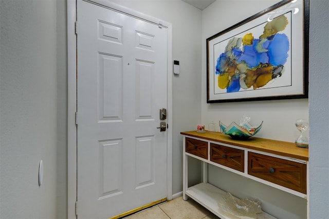 doorway to outside featuring light tile patterned floors