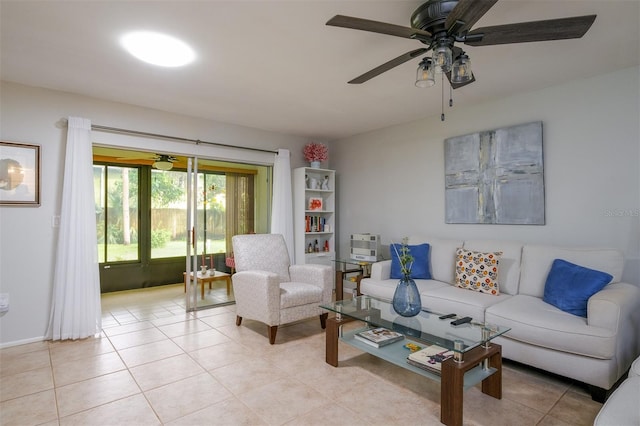 living area with light tile patterned floors and ceiling fan