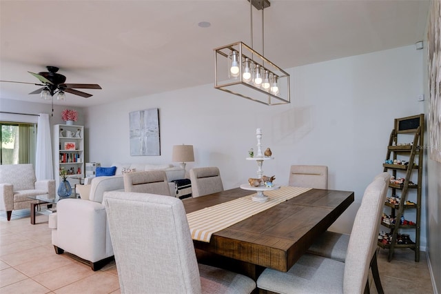 dining area featuring light tile patterned floors and ceiling fan