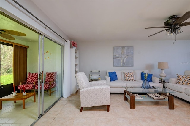 living room featuring ceiling fan and light tile patterned floors