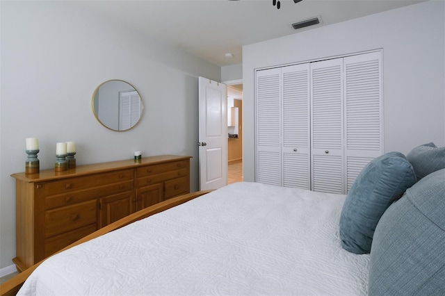 bedroom featuring a closet, ceiling fan, and visible vents