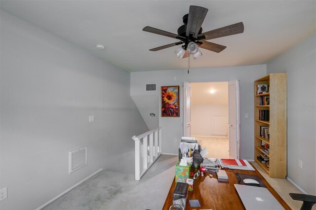 office with ceiling fan and light carpet