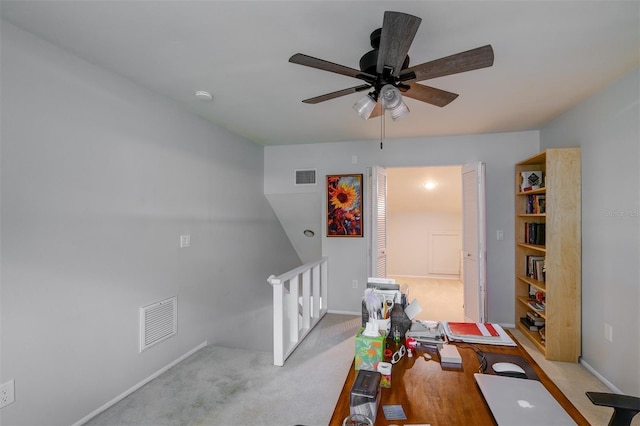 interior space with ceiling fan, baseboards, and visible vents