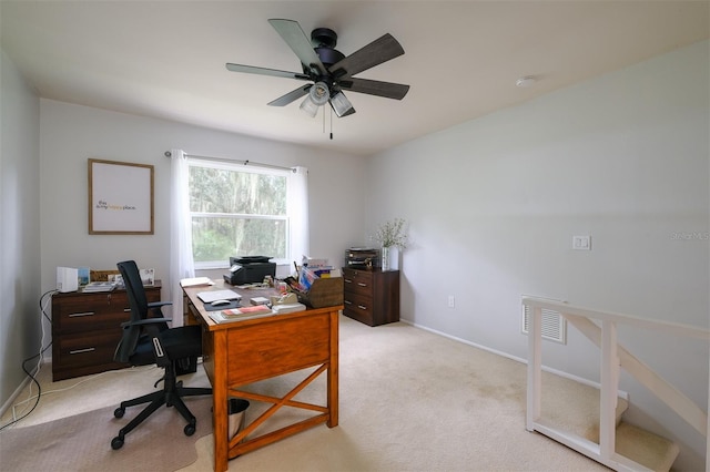 office with light carpet, ceiling fan, and baseboards