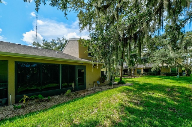 view of yard with a sunroom