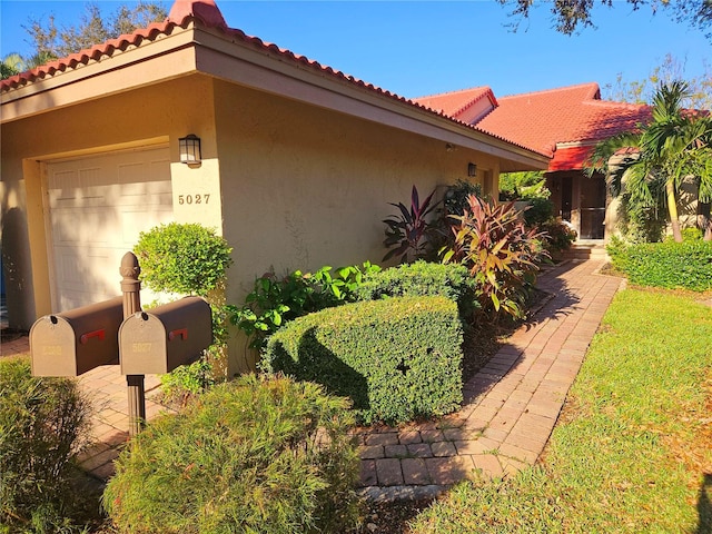 view of property exterior featuring a garage