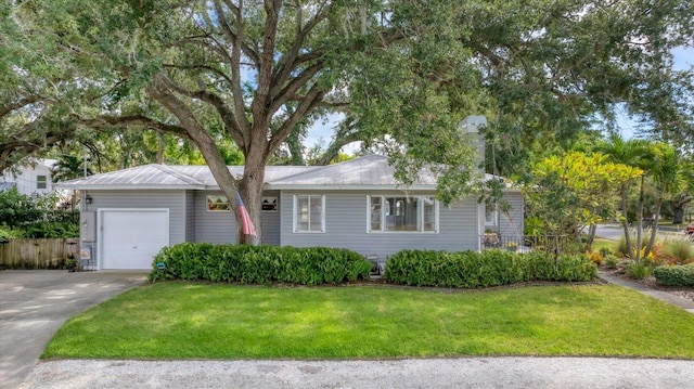 single story home featuring a front yard and a garage