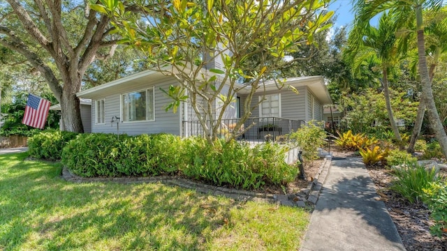 view of home's exterior with a lawn