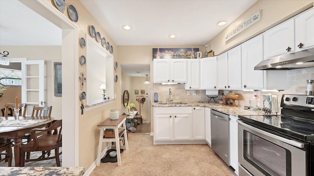 kitchen with tasteful backsplash, sink, stainless steel appliances, and white cabinets