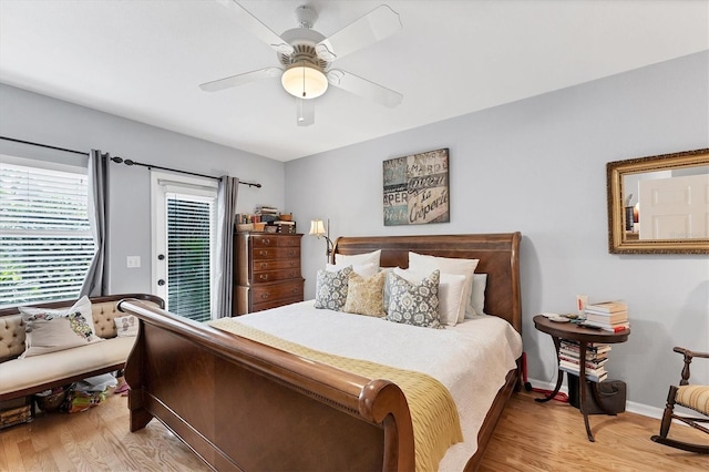 bedroom with baseboards, access to outside, light wood-type flooring, and a ceiling fan