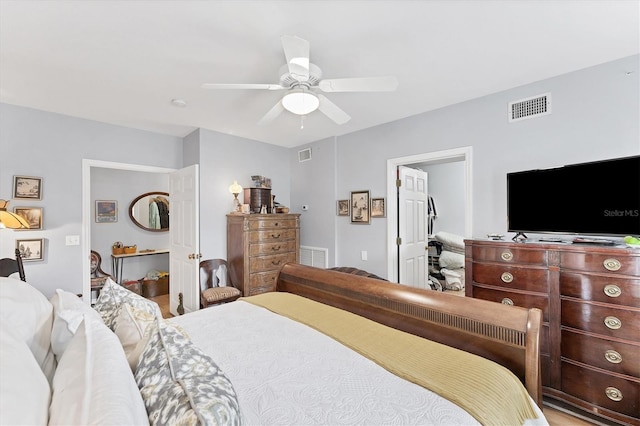 bedroom with ceiling fan and hardwood / wood-style flooring