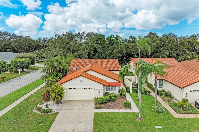 view of front of home featuring a front yard and a garage