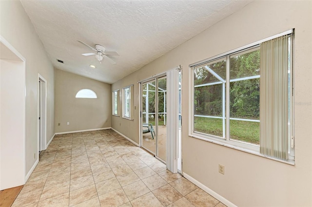 interior space featuring a textured ceiling and ceiling fan