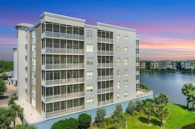 view of building exterior featuring a water view