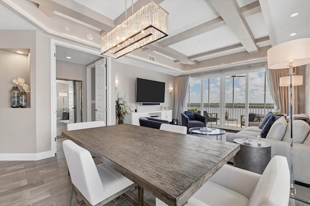 dining area with coffered ceiling, baseboards, visible vents, a chandelier, and beamed ceiling
