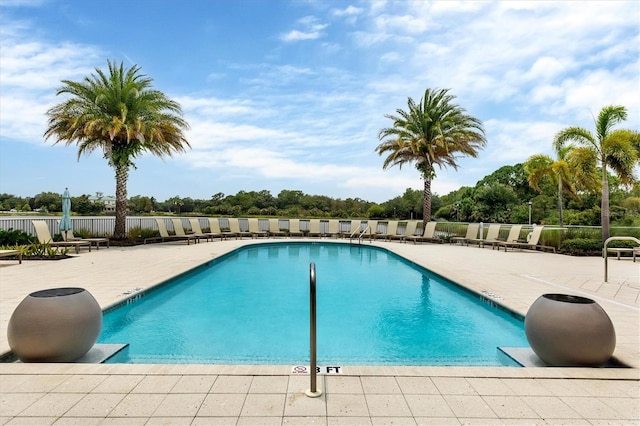 view of swimming pool featuring a patio area