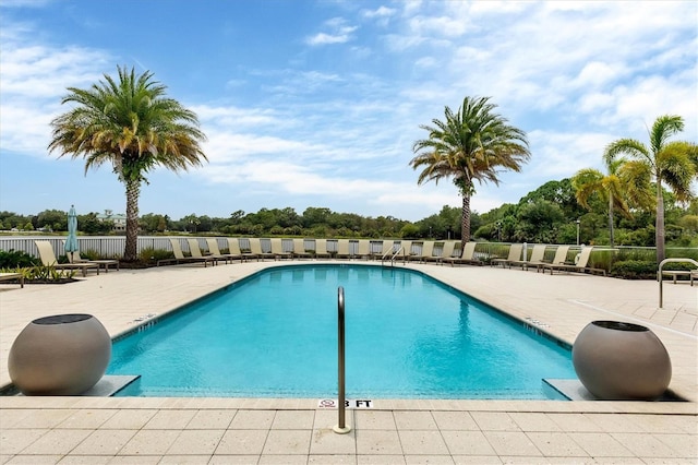 pool featuring a patio and fence