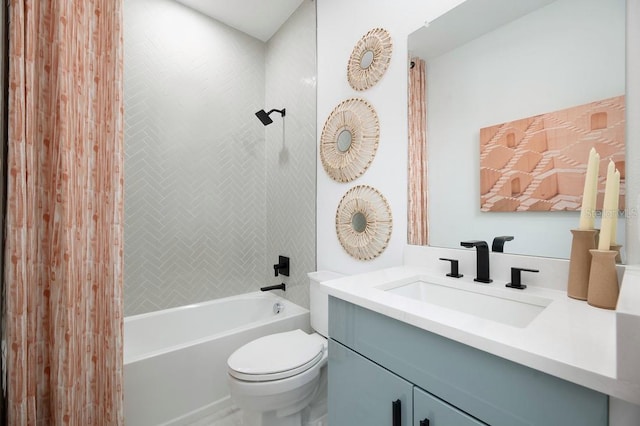 full bathroom featuring vanity, toilet, and tiled shower / bath