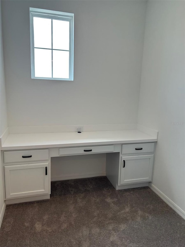 11722 Capstan Pl, Parrish, FL 34219 - unfurnished office with built in desk, dark carpet, and baseboards