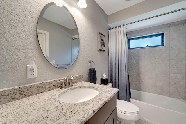 full bathroom with vanity, toilet, and shower / bath combo