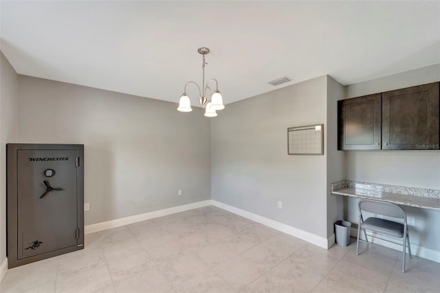 unfurnished dining area with light tile patterned floors and an inviting chandelier