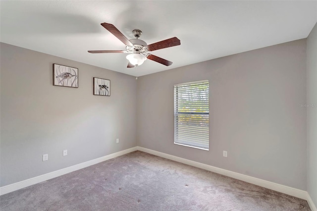 carpeted empty room with ceiling fan