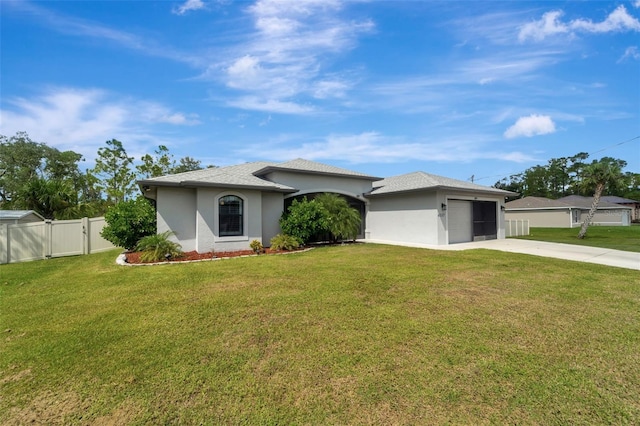 view of front facade featuring a front lawn and a garage