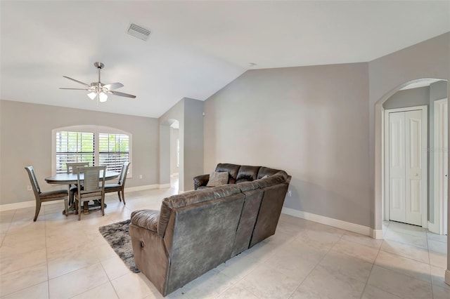 living room with vaulted ceiling, ceiling fan, and light tile patterned flooring