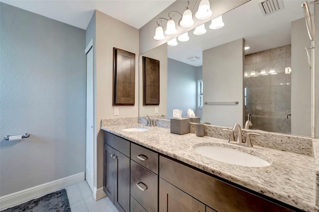 bathroom featuring tile patterned floors, vanity, and walk in shower