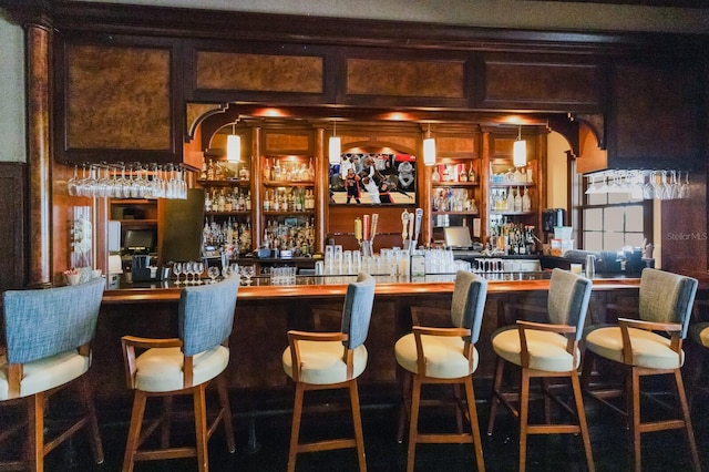 bar featuring wood walls