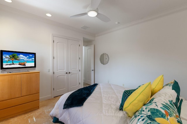 bedroom with ceiling fan, a closet, and ornamental molding