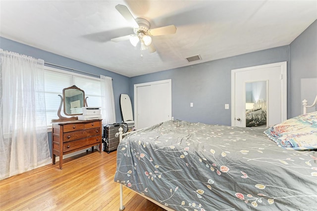 bedroom featuring wood-type flooring and ceiling fan