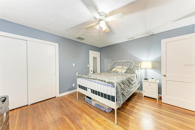 bedroom featuring ceiling fan, a closet, and light hardwood / wood-style floors