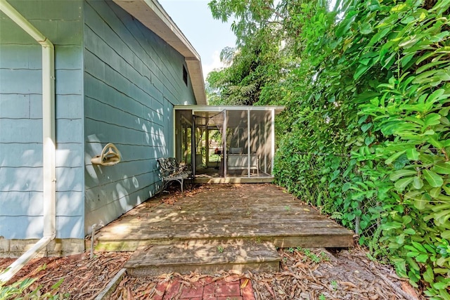 wooden deck featuring a sunroom