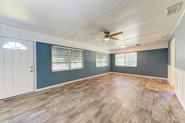 foyer featuring ceiling fan and light hardwood / wood-style floors