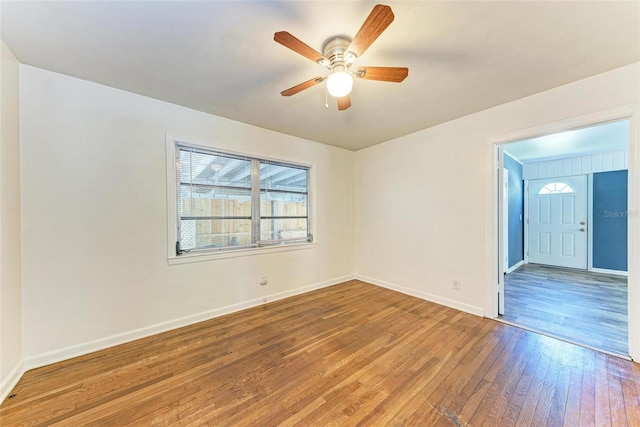 empty room with wood-type flooring and ceiling fan