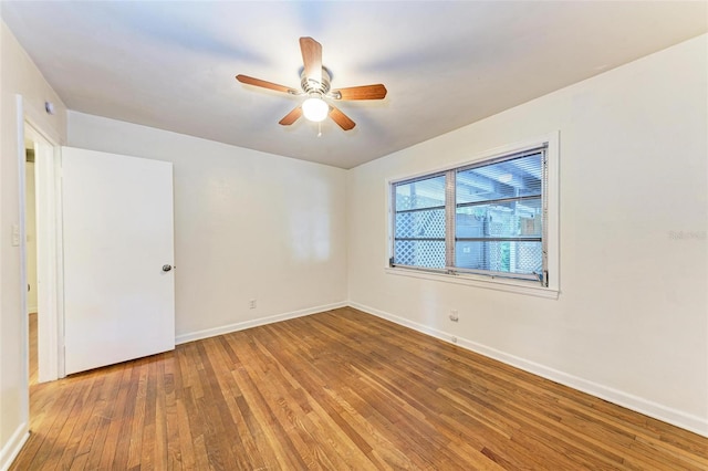 empty room featuring ceiling fan and hardwood / wood-style floors