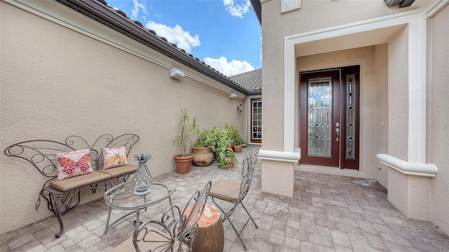 entrance to property with a patio