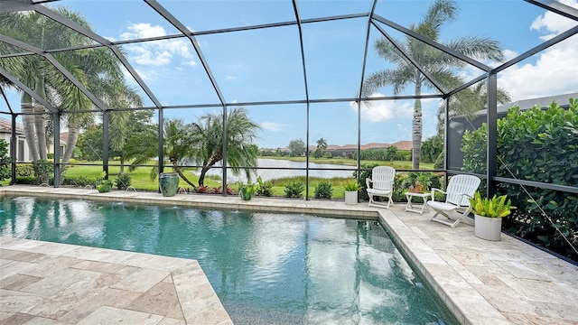 view of swimming pool featuring glass enclosure, a water view, and a patio