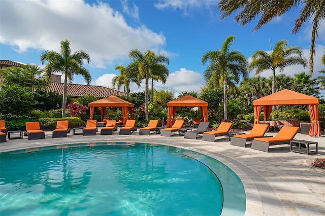 view of pool with a patio and a gazebo