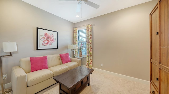 living room featuring ceiling fan and light carpet