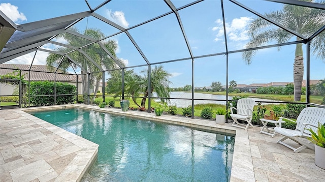 view of swimming pool featuring a patio, a water view, and glass enclosure