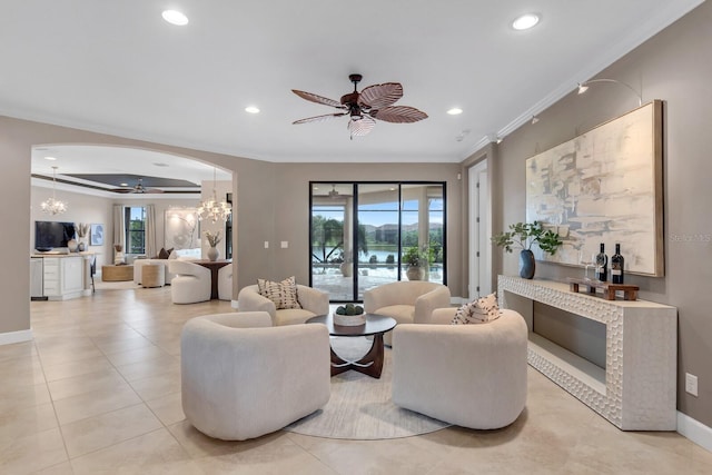 12663 Fontana Loop, Bradenton, FL 34211 - living area with ornamental molding, arched walkways, recessed lighting, a ceiling fan, and a water view