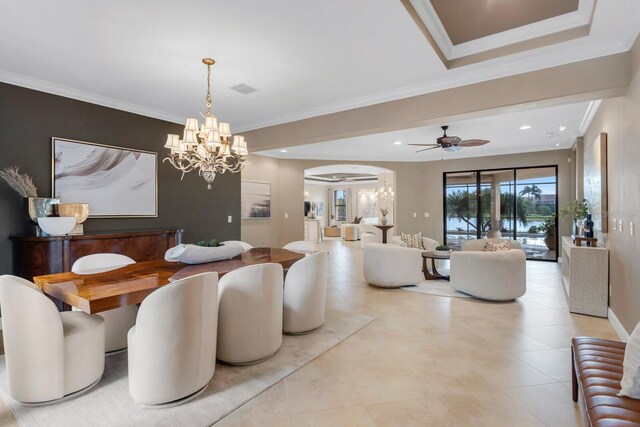 12663 Fontana Loop, Bradenton, FL 34211 - dining area featuring a chandelier, arched walkways, ornamental molding, and recessed lighting