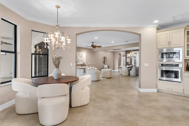 12663 Fontana Loop, Bradenton, FL 34211 - dining area featuring arched walkways, a chandelier, a ceiling fan, ornamental molding, and light tile patterned flooring