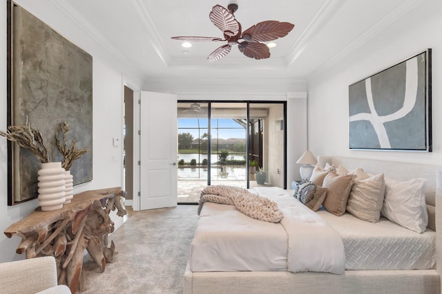 12663 Fontana Loop, Bradenton, FL 34211 - bedroom featuring access to exterior, crown molding, carpet flooring, a water view, and a tray ceiling