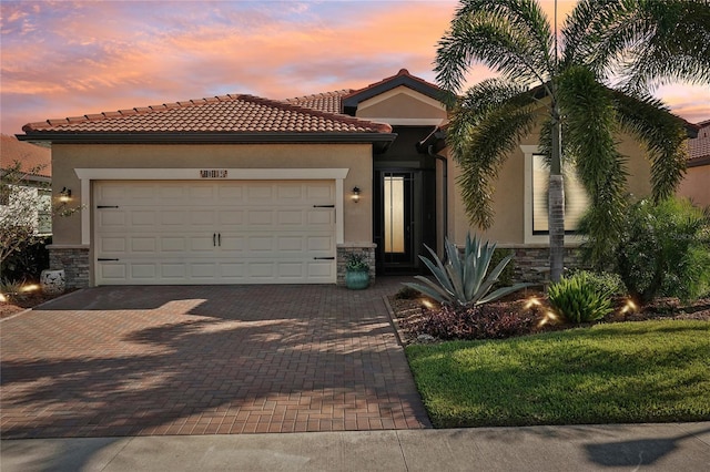 mediterranean / spanish-style home featuring a garage