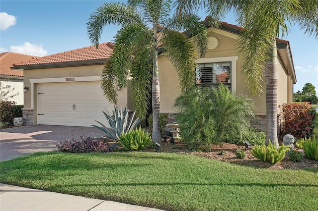 view of front of house featuring a garage and a front lawn